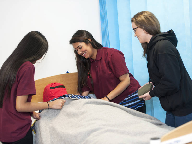 Health and social care students practical learning in the health suite at Highbury Campus