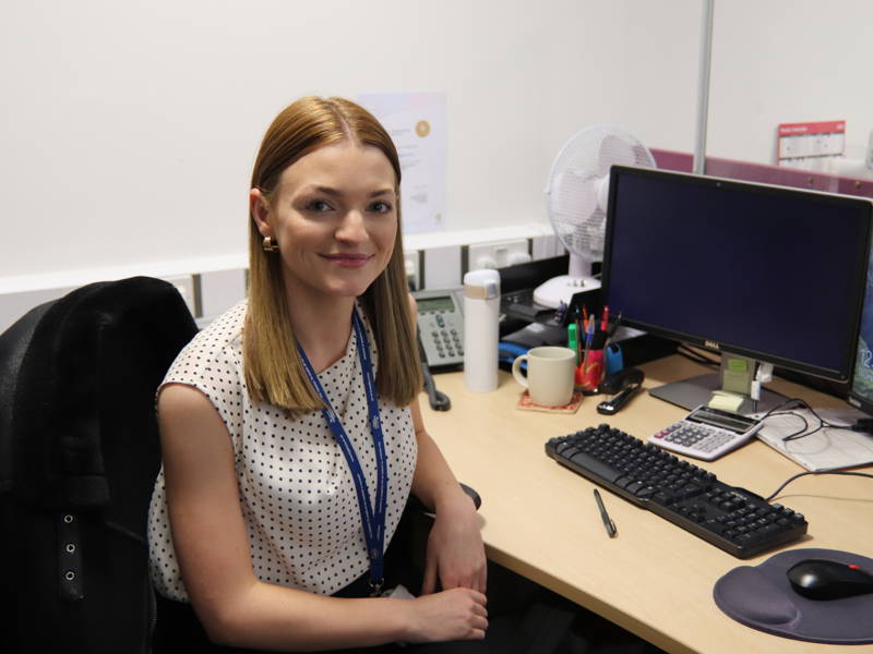A female City of Portsmouth College student studying at a computer for AAT accounting