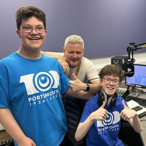 Students Daniel Runham and James Rogers at the Express FM mixing desk with presenter Ian James