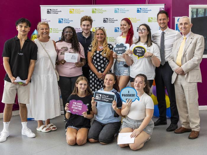 Students pose for a celebratory photo with Katy Quinn, Principal and CEO, MPs Amanda Martin and Stephen Morgan, and chair of governors, Tim Jackson OBE