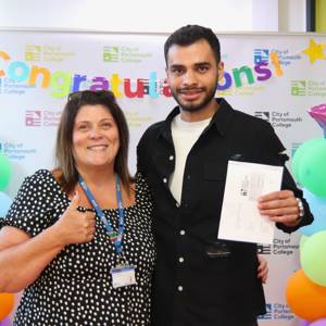 English teacher Debbie Hughes celebrates with her student, Rasoul Ebrahim