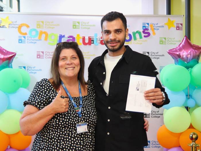 English teacher Debbie Hughes celebrates with her student, Rasoul Ebrahim