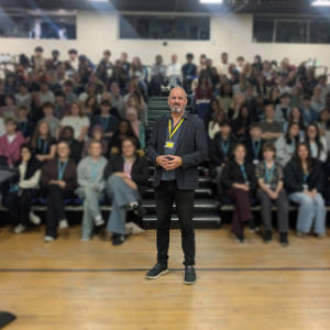 Richard Higginson, centre, stands in front of A Level Psychology students at Sixth Form Campus