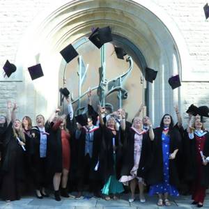 City of Portsmouth College higher education graduates celebrate outside Portsmouth Cathedral