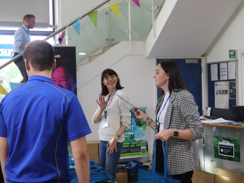 Friendly staff welcoming visitors to North Harbour Campus.