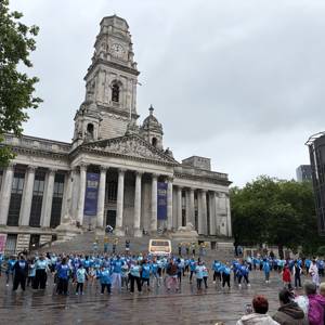 A panoramic shot of Portsmouth's Guildhall Square. In front are 250 performers in the finale of their Portsmouth 100 flashmob dance.